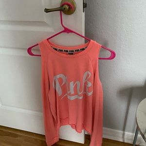 pink long sleeve with cuts on shoulders